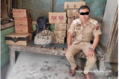White Indica car labeled “POLICE” intercepted at Watiyongpang check gate with illegal liquor inside.